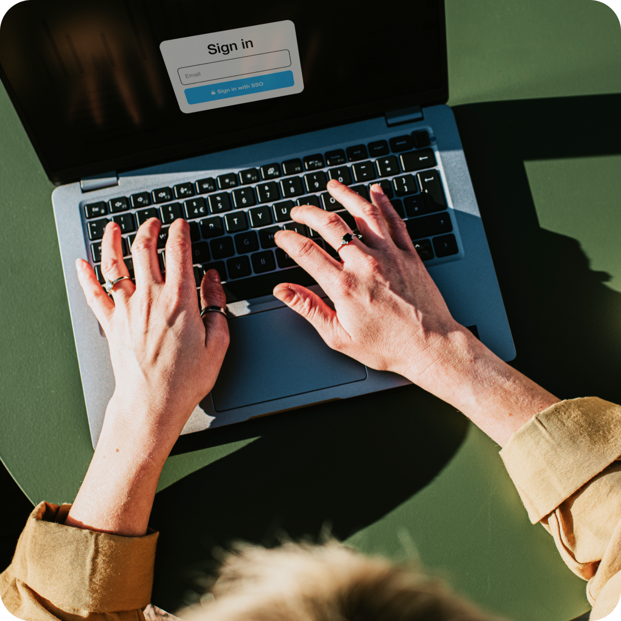 Laptop computer with a person signing into a secure enterprise-grade video platform