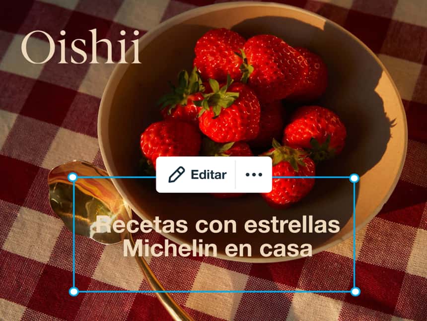 Hay fresas rojas brillantes de la marca Oishii dentro de un cuenco. El texto dice: "Michelin-Starred Recipes, At Home".