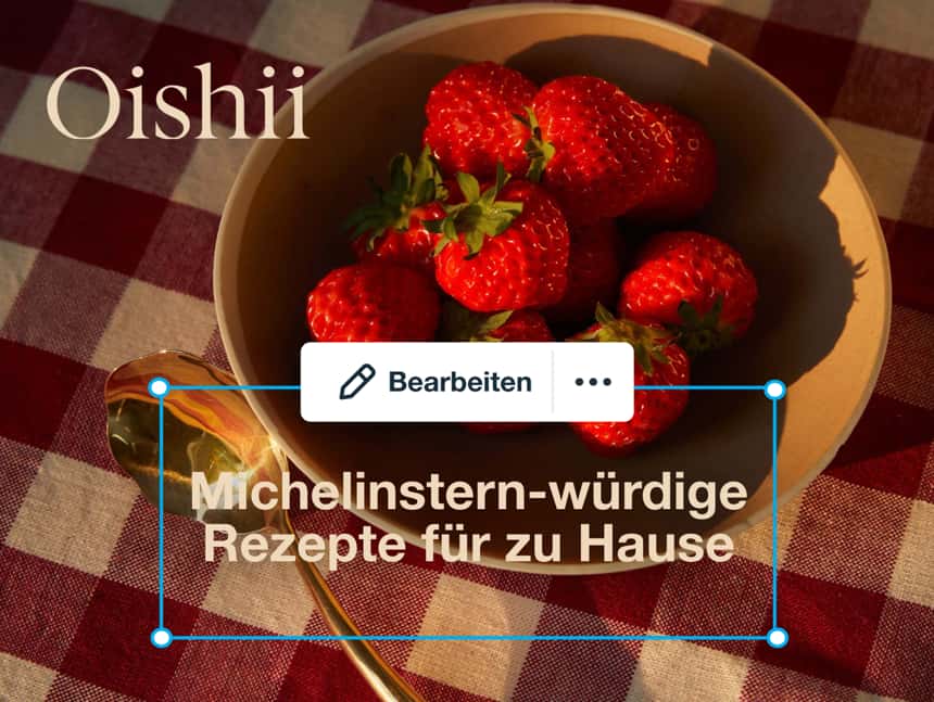 Leuchtend rote Erdbeeren in einer Schale; von der Marke Oishii gezüchtet. Der Textbaustein lautet: „Michelin-Starred Recipes, At Home“.