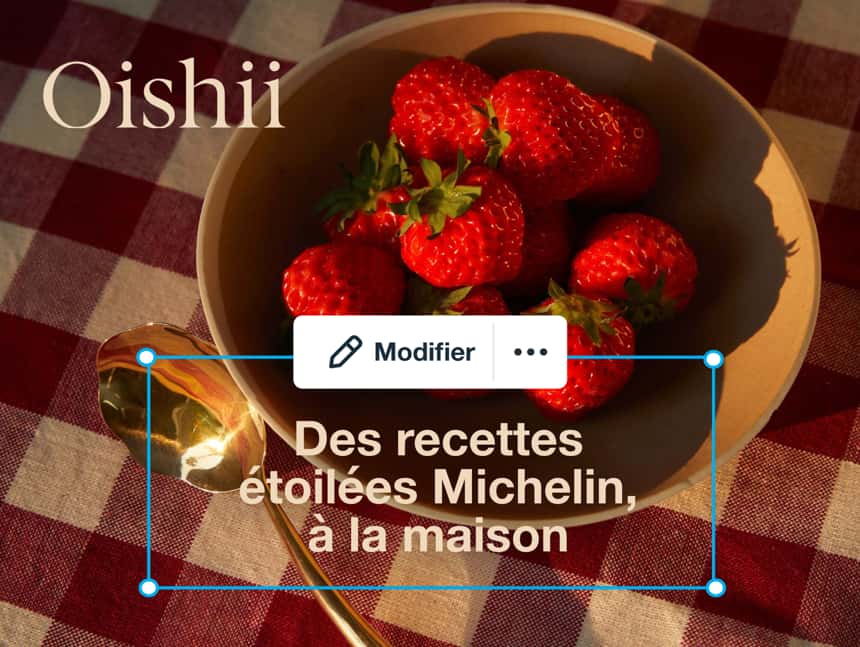 des fraises rouge vif dans un bol, cultivées par la marque Oishii. Le texte se lit comme suit « Des recettes de chefs étoilés du Michelin, à la maison. »