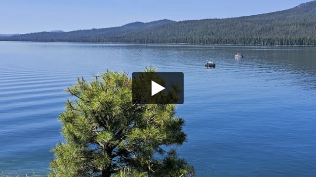 Boats on Diamond Lake with Mount Bailey in the background.