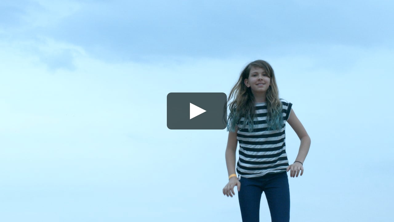 A preteen girl jumping into the sky in super slow motion, 120 FPS |   Stock