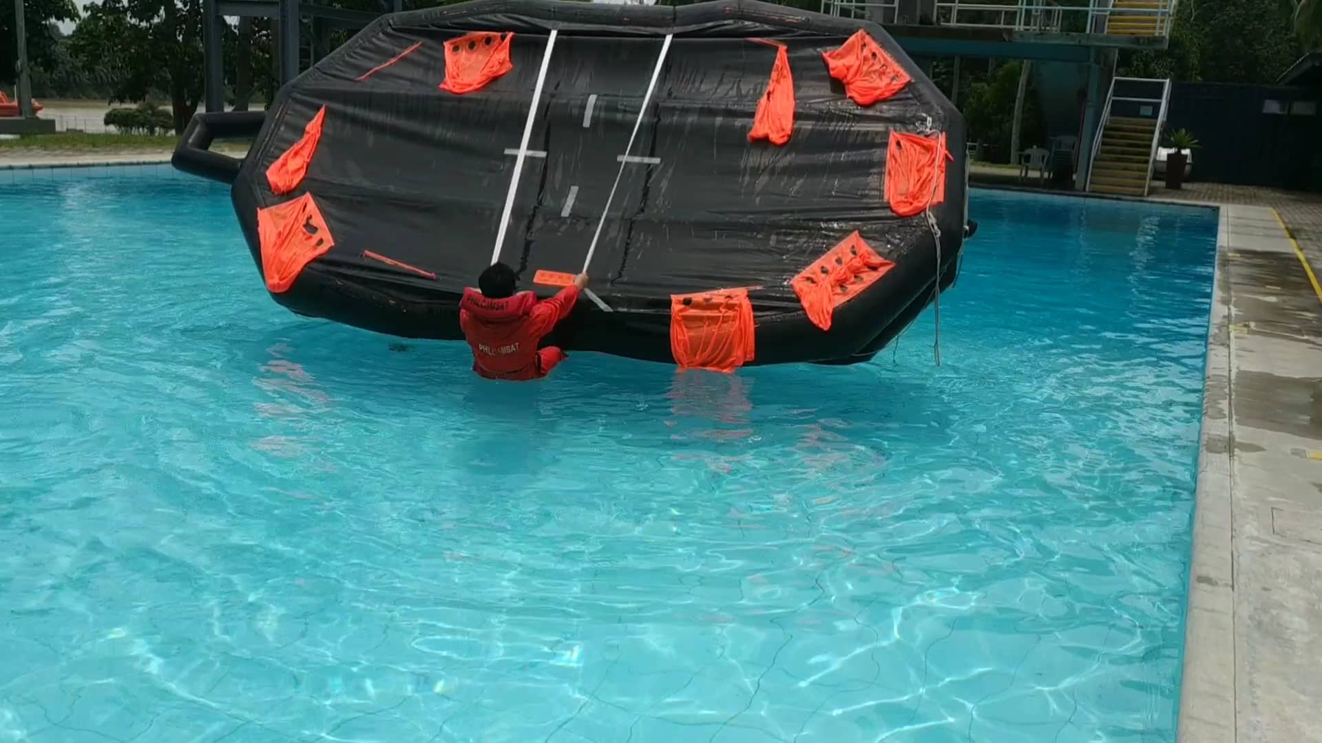Video 4 - Rights an inverted life raft while wearing a lifejacket on Vimeo