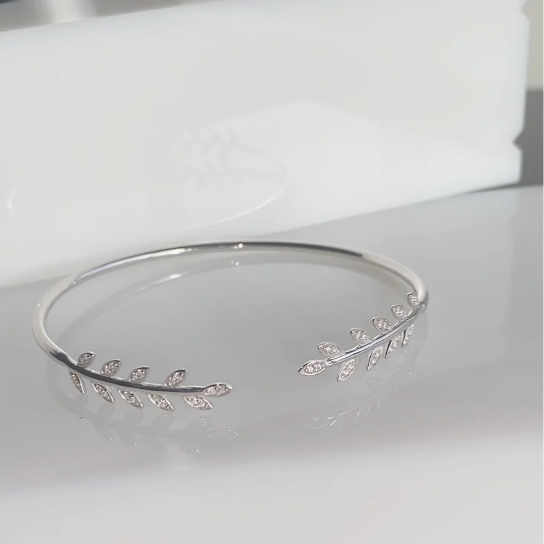 925 sterling silver open bangle with white stone set leaf
