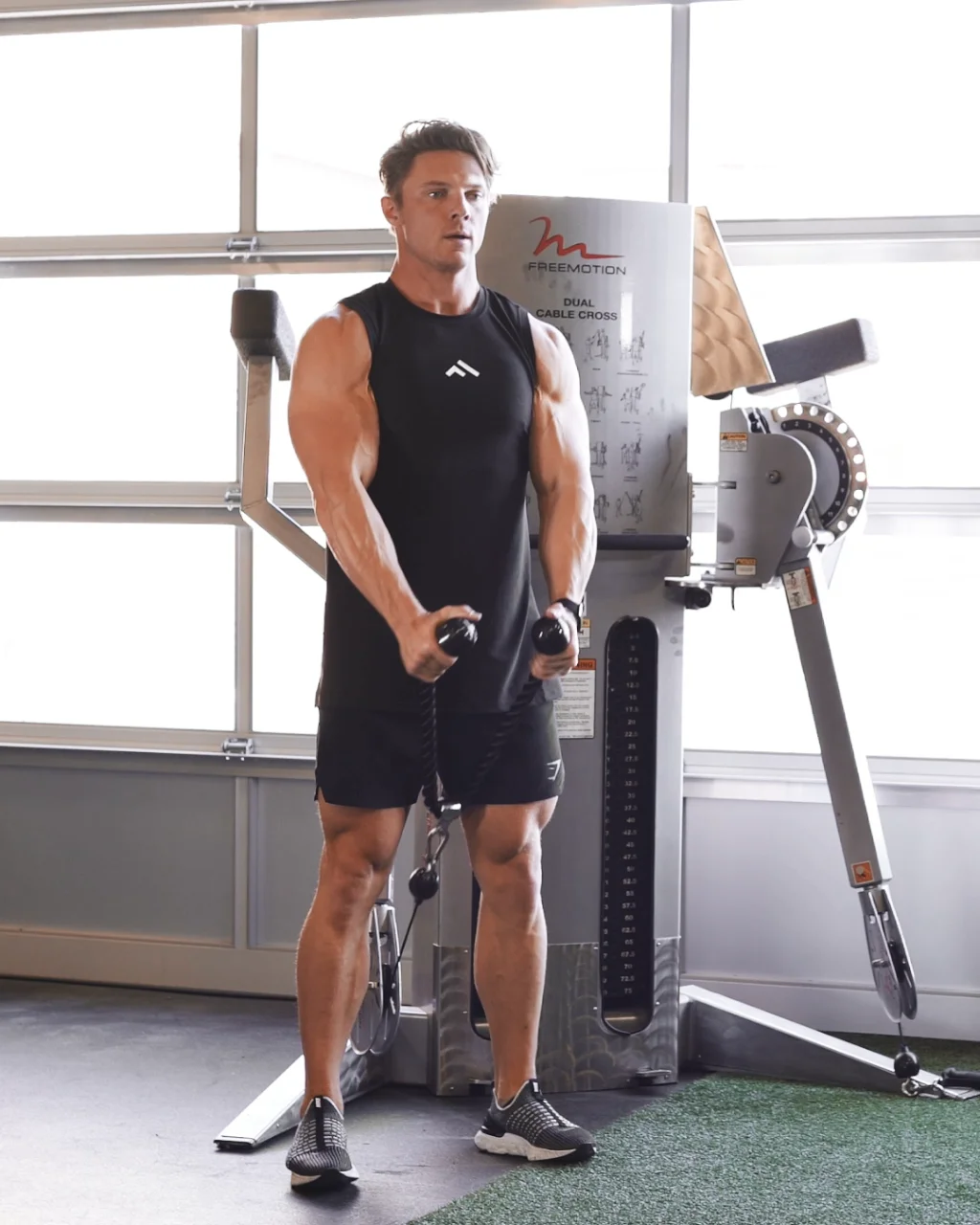 Double cable front raise exercise guide and video