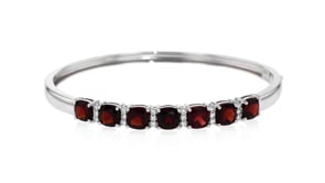 7.00 ct. t.w. Garnet and .32 ct. t.w. White Zircon Bangle Bracelet in Sterling Silver