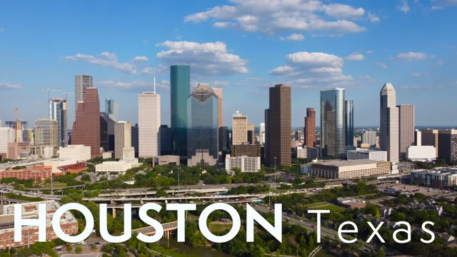 Made a wallpaper with the Houston skyline with Travis wearing his