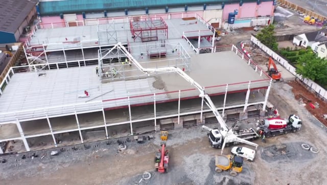 Erne Concrete Pumping | Topping off a metal deck roof slab at the iconic Kings Hall, Belfast