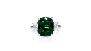 6.25 Carat Simulated Emerald and 1.10 ct. t.w. CZ Three-Stone Ring in Sterling Silver
