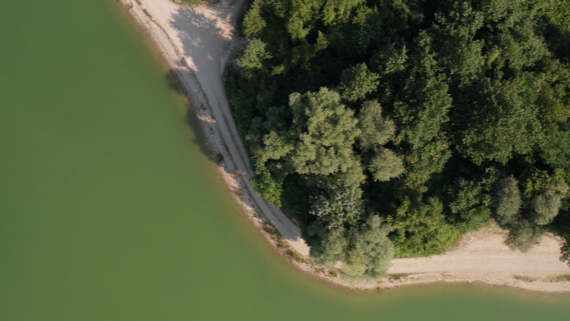 Road by the lake top view