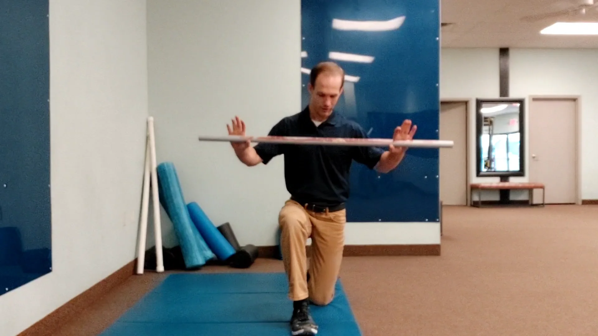 1/2 Kneeling Torso Rotation with Dowel
