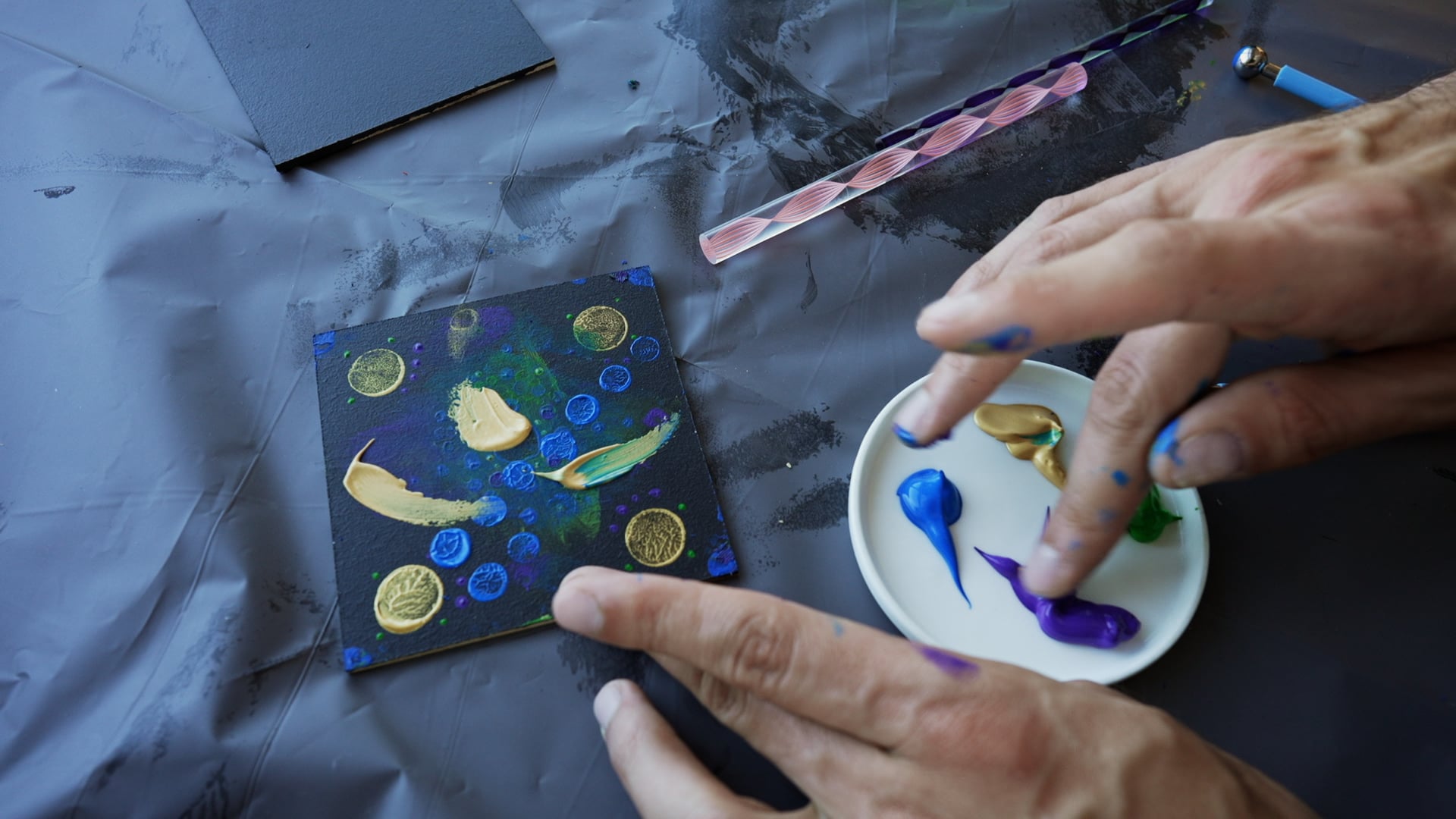 Painting with hands and with dotting tools