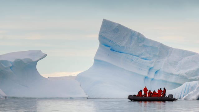 Zodiac craft near iceberg, Antarctica