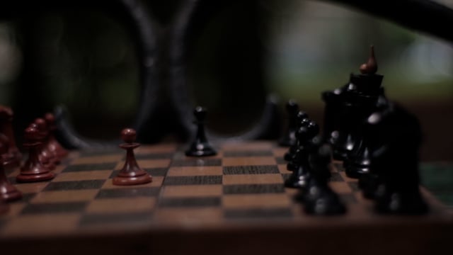 Close Up Of Chess Board Pieces With Player Hand Moving Chess Piece Creating  Shadow Free Stock Video Footage Download Clips Education