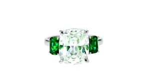 6.25 Carat CZ and 1.10 ct. t.w. Simulated Emerald Three-Stone Ring in Sterling Silver