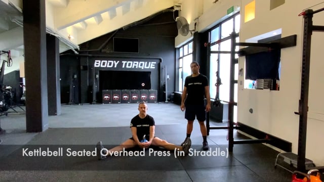 Kettlebell Seated Overhead Press (Straddle)