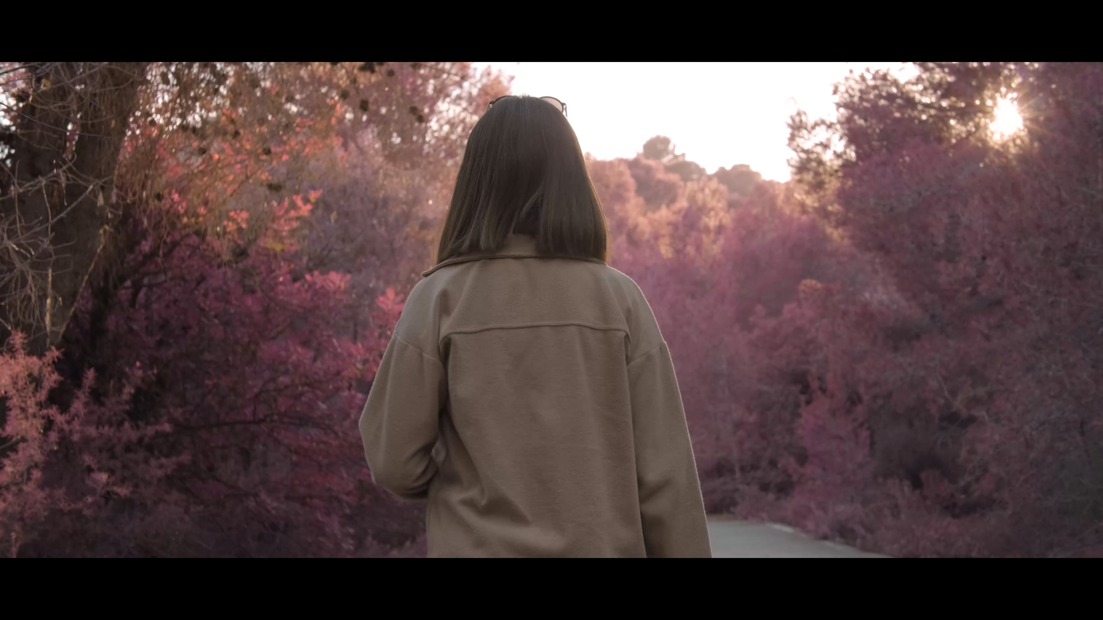 Girl walking in purple forest