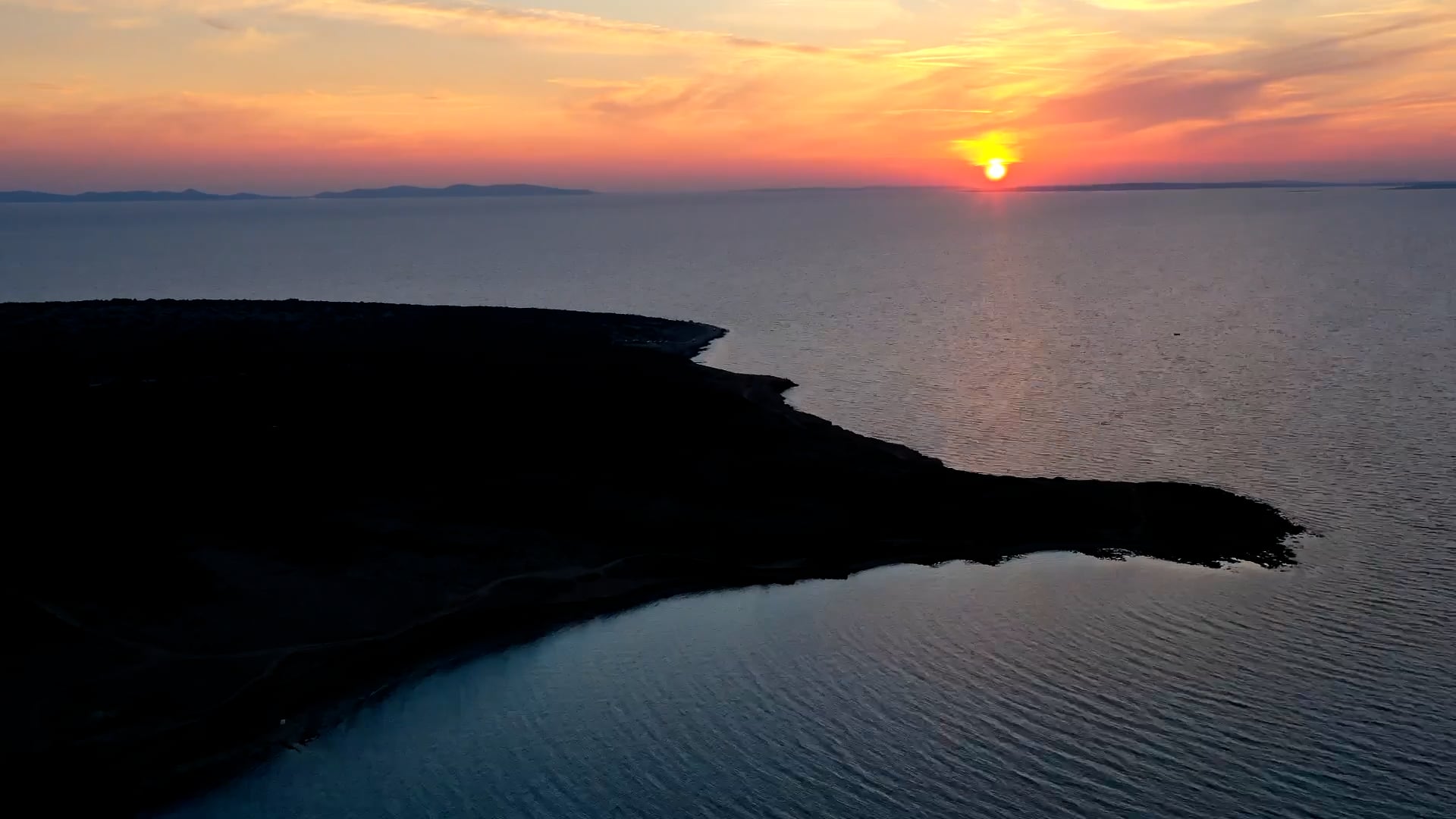 Sunset above sea horizon aerial hyperlapse