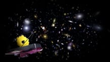 Artist's concept of the James Webb Space Telescope against a field of galaxies.