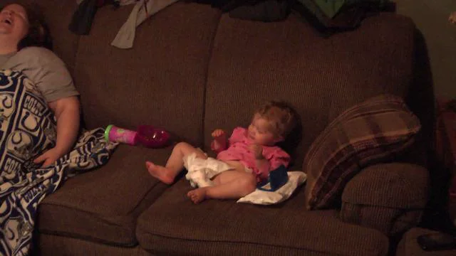 Claire attempting to change her own diaper