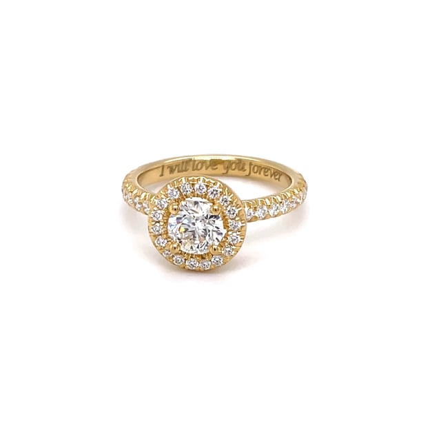 0.70 carat solitaire halo ring in yellow gold with round diamonds