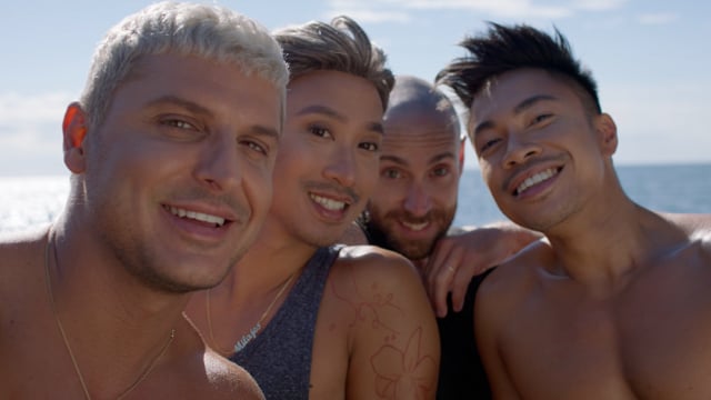 Selfie shot of a group of friends. Summer fun! A diverse group of loving and happy LGBTQ men taking selfie photos on the beach. 