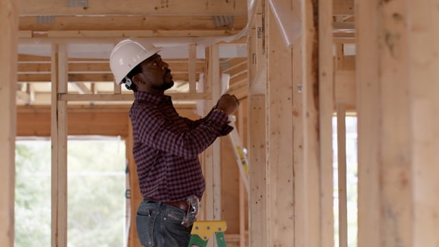 An African American architect working on his dream home. 