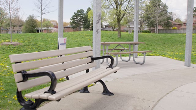 Pandemic social distancing closures. Covid-19 pandemic. Empty park bench Shot in 4k.