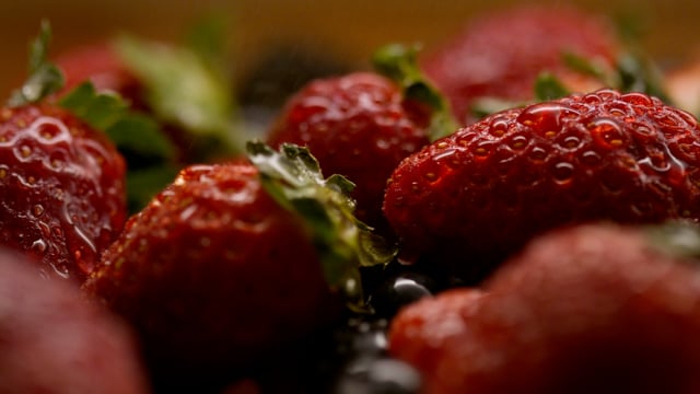 Farm fresh organic berries being misted in slow motion. 