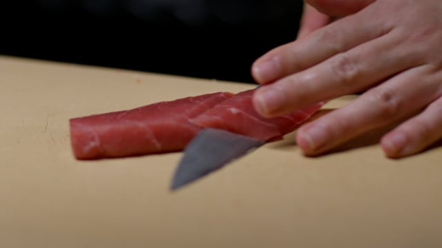 Japanese cuisine preparation. Creating amazing sushi and sashimi at a high-end sushi restaurant.