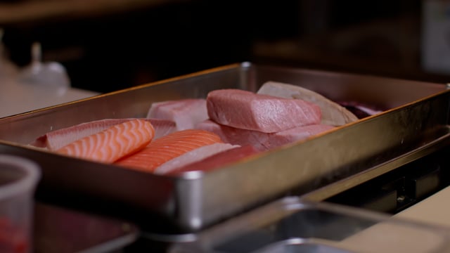 Fresh fish for gourmet Japanese chef. Creating amazing sushi and sashimi at a high-end sushi restaurant.