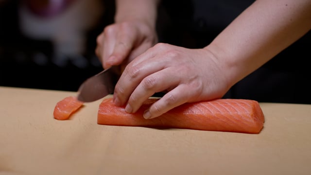 Sushi preparation in a Japanese kitchen. Creating amazing sushi and sashimi at a high-end sushi restaurant.