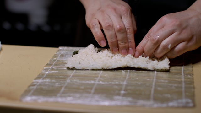Sushi hand roll. Creating amazing sushi and sashimi at a high-end sushi restaurant.