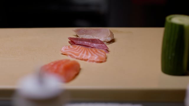 Sushi preparation in a Japanese kitchen. Creating amazing sushi and sashimi at a high-end sushi restaurant. 