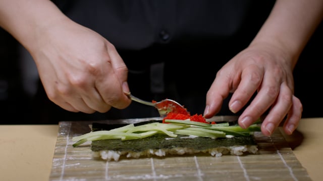Hand roll creation. Creating amazing sushi and sashimi at a high-end sushi restaurant.