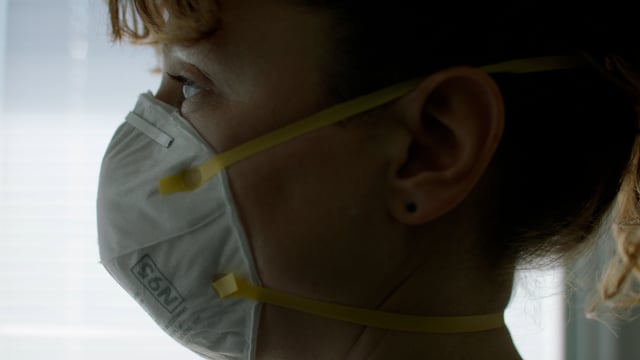 Wearing a medical mask during a covid-19 pandemic by a nurse. Wearing a protective face mask. 