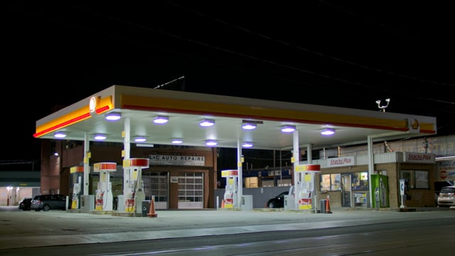 Exterior gas station establishing shot night. Matching set of day night establishing shots. 