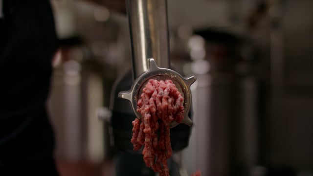 Meat grinder preparing delicious hamburger patties. How the sausage is made!