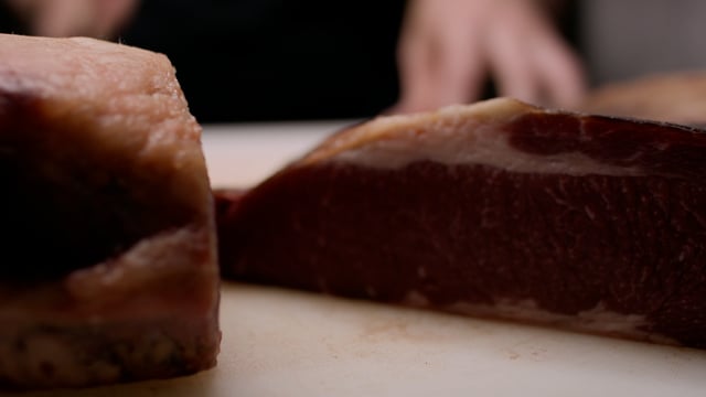 Chef shows off a delicious dry aged and smoked bbq brisket and prepares this gorgeous piece of meat for a tasty meal.