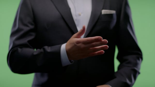 Waving a hand in welcoming gesture from Businessman on green screen. 
