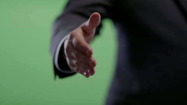 Handshake from Businessman on green screen.