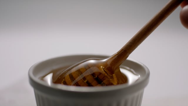 Honey drip. Beautiful honey shot in slow motion. 