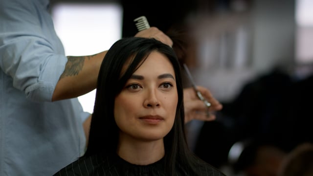 Beauty salon hair cut. A woman gets her hair done at a stylish salon.