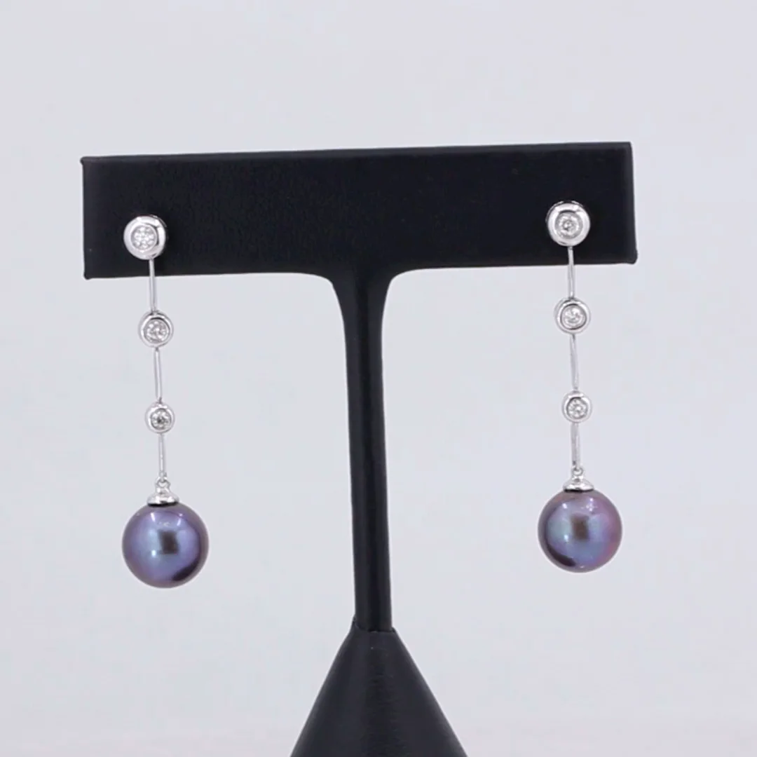 Sold 14k white gold and black pearl earrings