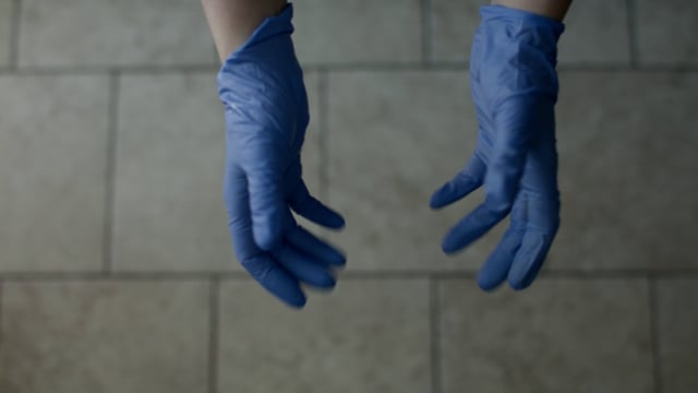 Medical gloves used during coronavirus pandemic by a doctor. Wearing protective medical gear. 