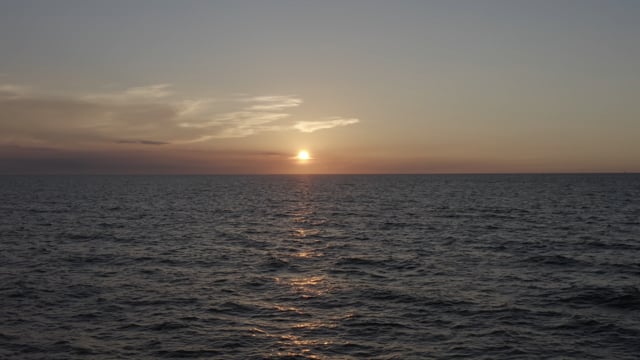 A beautiful coastal sunset in Florida, looking out upon the ocean.  