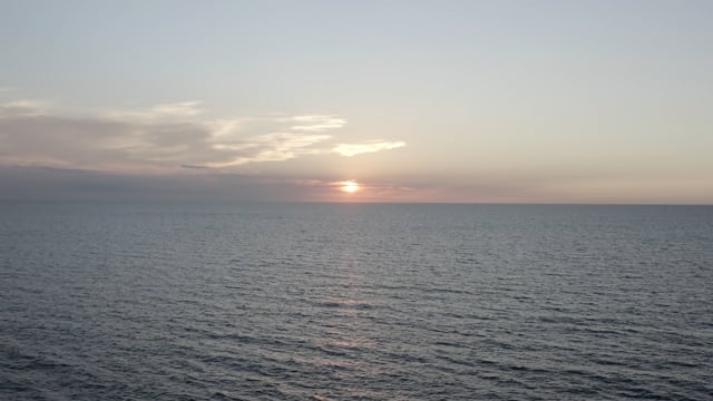 A beautiful coastal sunset in Florida, looking out upon the ocean.  