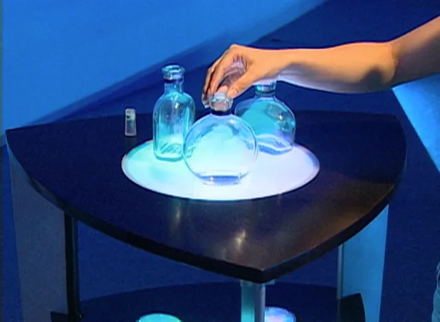 Plastic Bottle Of Drink Water And Reflection On Table With