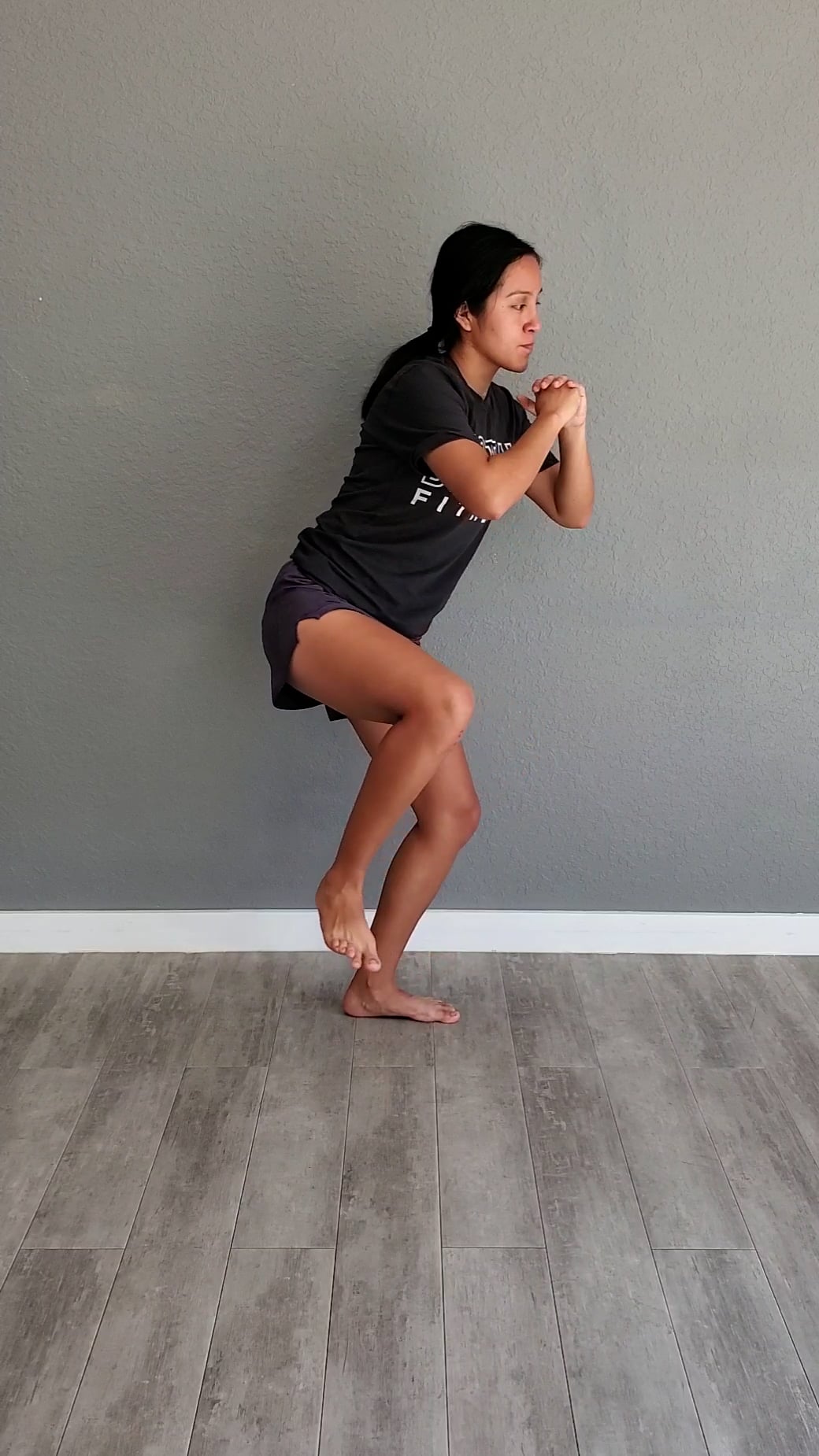 One leg deep squat hold with trunk rotations toward the non weight ...