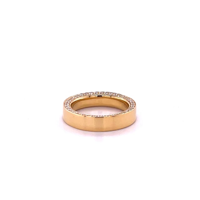 0.70 carat eternity ring in yellow gold with small round diamonds on the side